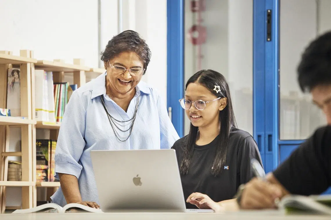 Retired teacher Mangeyar Karasi (left), a volunteer at =Dreams, has helped scholar Nurul A'Syaqirah Kasim grow in confidence and public speaking skills. 