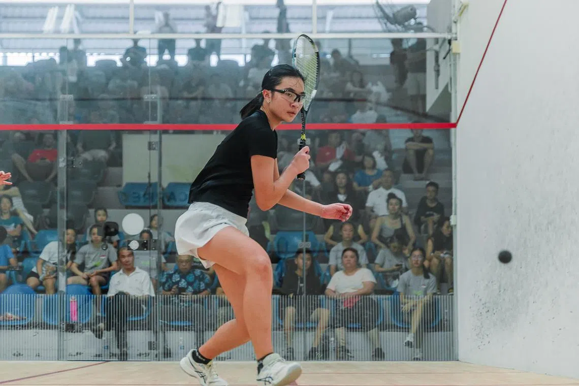 Singapore squash junior Ong Zhe Sim was handed a six-month probation after "breaching her Athlete's Agreement".