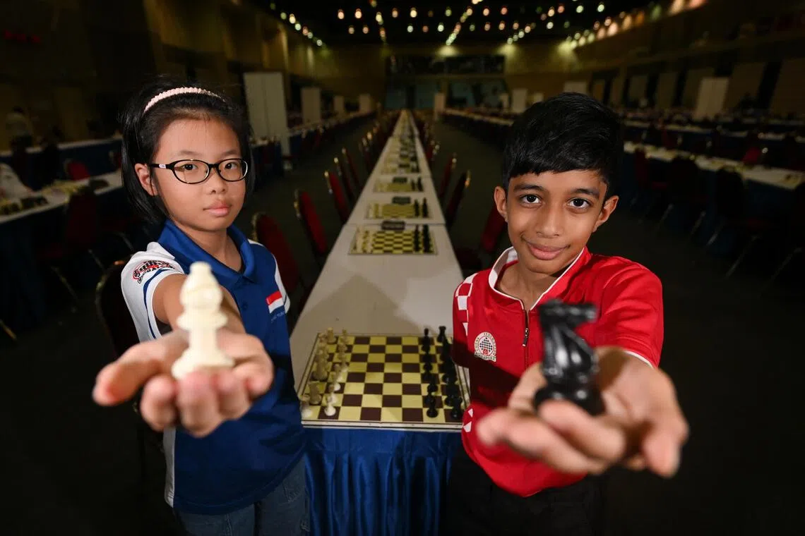 Zhang Yunyi (left) and Ashwath Kaushik pictured during the 24th ASEAN+ Age Group Chess Championships at Our Tampines Hub on Aug 15.