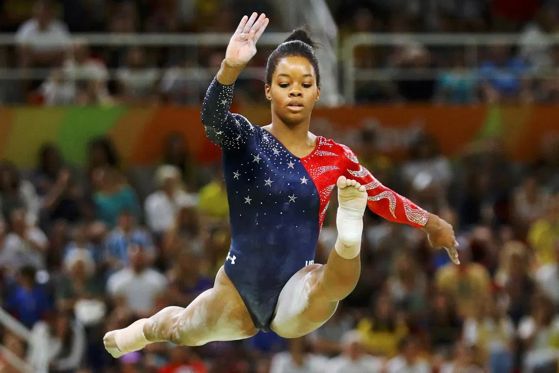 FILE PHOTO: 2016 Rio Olympics - Artistic Gymnastics - Preliminary - Women's Qualification - Subdivisions - Rio Olympic Arena - Rio de Janeiro, Brazil - 07/08/2016. Gabrielle Douglas (USA) of USA (Gabby Douglas) competes on the beam during the women's qualifications.   REUTERS/Mike Blake/File Photo