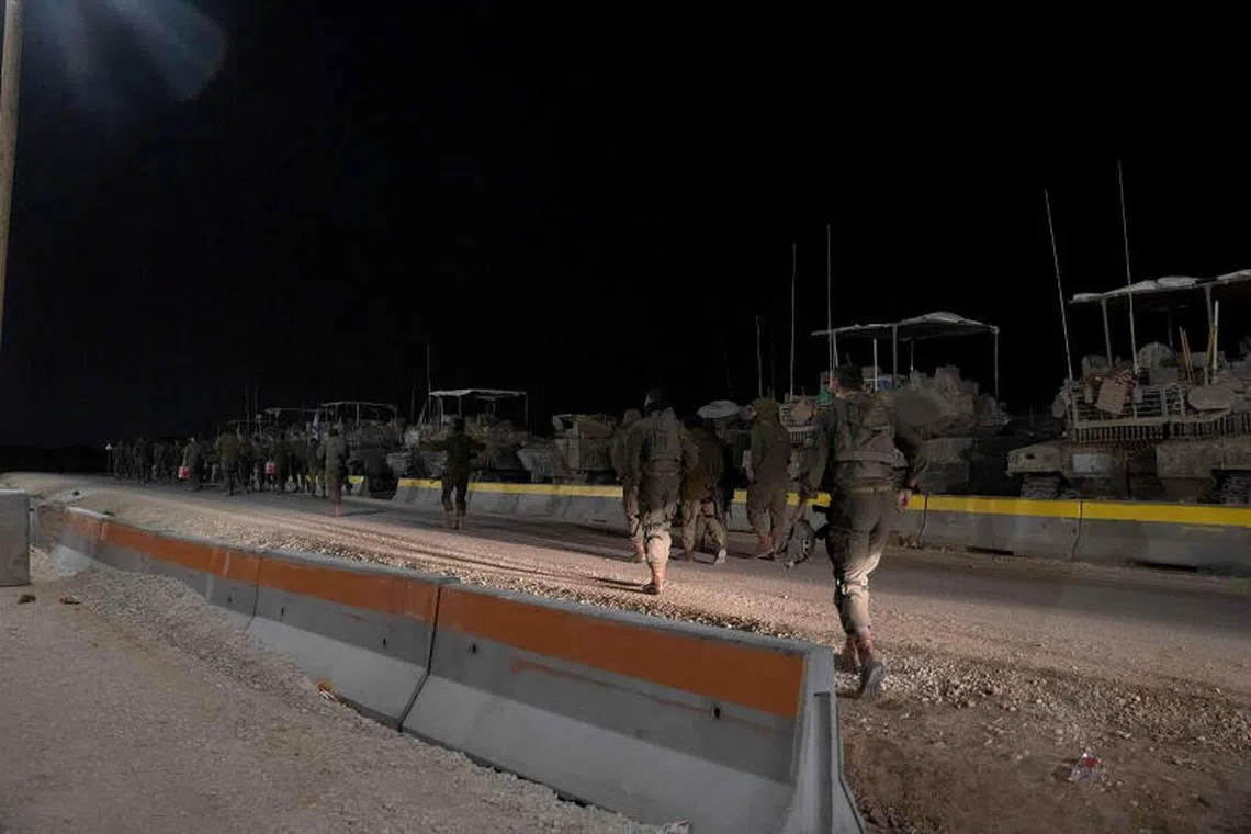 This handout picture released by the Israeli army on December 28, 2024, shows troops reportedly preparing to enter the Beit Hanoun area in the northern Gaza Strip. The Israeli military says it has killed hundreds of militants since the stepped-up assault in northern Gaza began on October 6, while rescuers in the area say thousands of civilians have died in the sweeping offensive. (Photo by Israeli Army / AFP) / === RESTRICTED TO EDITORIAL USE - MANDATORY CREDIT “AFP PHOTO / Handout / Israeli Army’ - NO MARKETING NO ADVERTISING CAMPAIGNS - DISTRIBUTED AS A SERVICE TO CLIENTS ==
