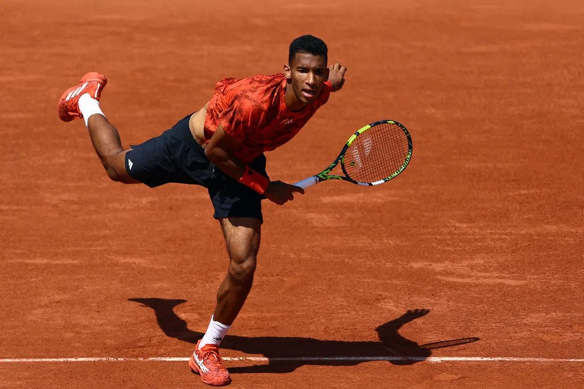 Canada's Felix Auger-Aliassime in action during his first round match against Italy's Fabio Fognini.