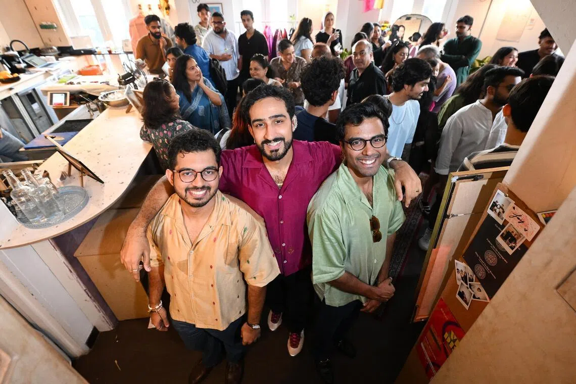 The Dori co-founders Ajinkya Kulkarni, 27, Rishabh Sharma, 27, and Laavanya Kejriwal, 27, with customers at One Trick Pony bar on July 19.