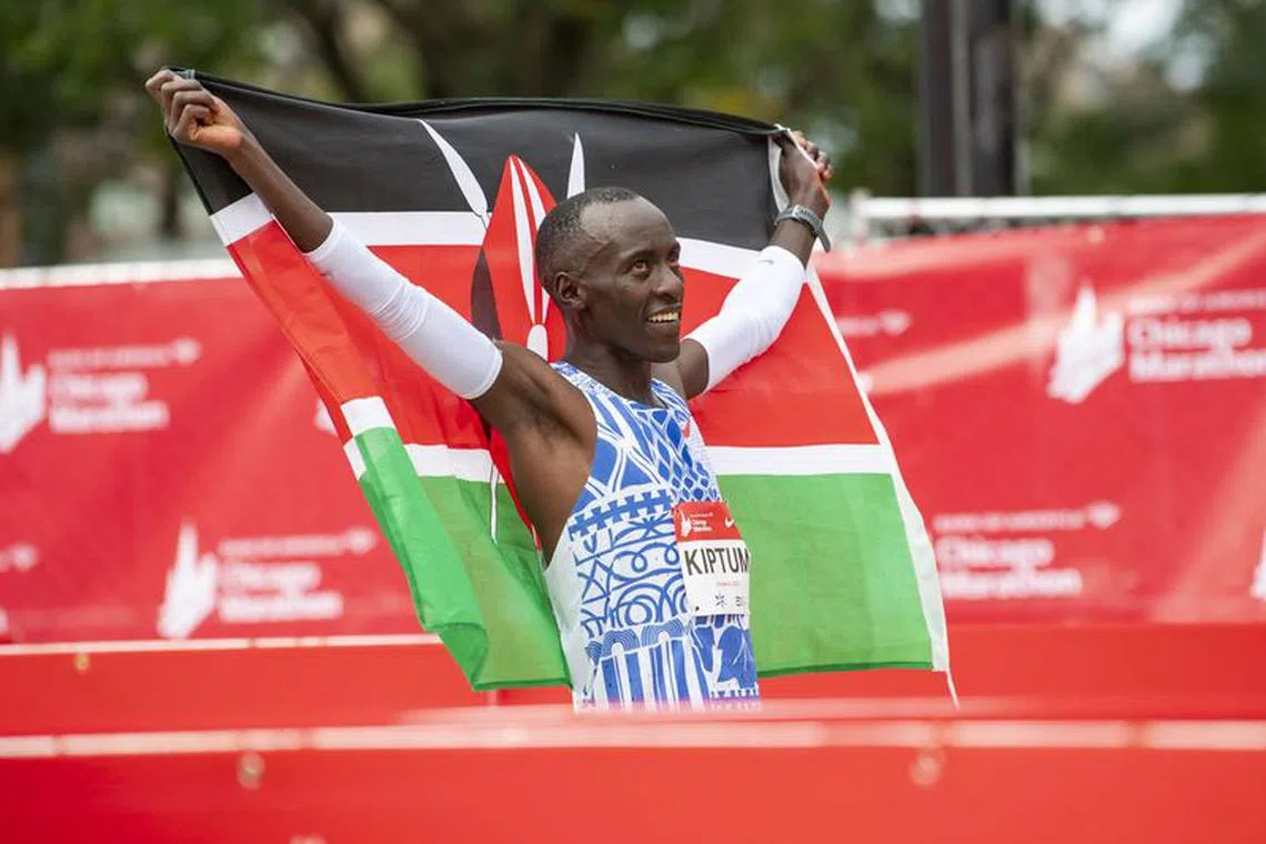 Oct 8, 2023; Chicago, IL, USA; Kelvin Kiptum of Kenya celebrates after finishing in a world record time of 2:00:35 to win the Chicago Marathon at Grant Park. Mandatory Credit: Patrick Gorski-USA TODAY Sports/File Photo