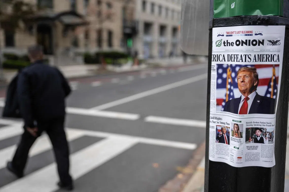 A copy of "The Onion," a satirical newspaper, is seen on a lamppost in downtown Washington, DC on Nov 14.
