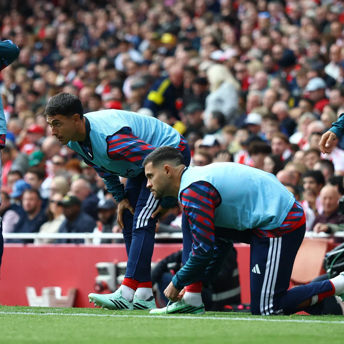 Arsenal’s Viktor Gyokeres, Martin Zubimendi, Bruno Guimaraes and Piero Hincapie warm up as substitutes during their match against Leeds United on Oct 10.