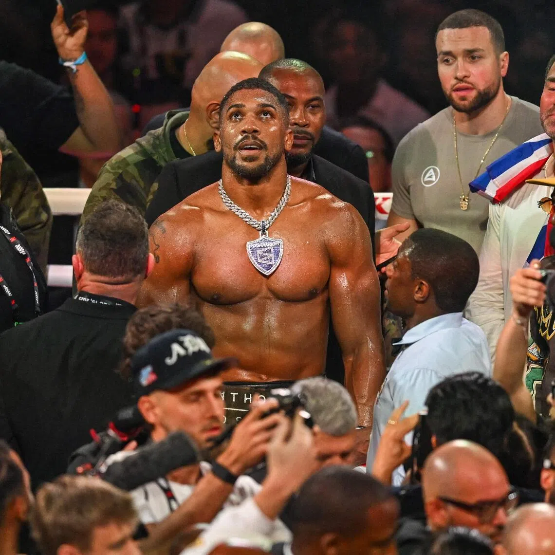 British boxer Anthony Joshua celebrates after defeating US boxer and influencer Jake Paul (off frame) in a non-title heavyweight bout at the Kaseya Center in Miami.