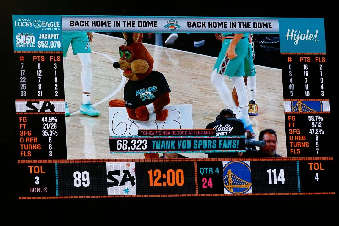 The record attendance of 68,323 is announced at the end of the third quarter during the game between the Golden State Warriors and the San Antonio Spurs at the Alamodome on Friday in San Antonio, Texas. 