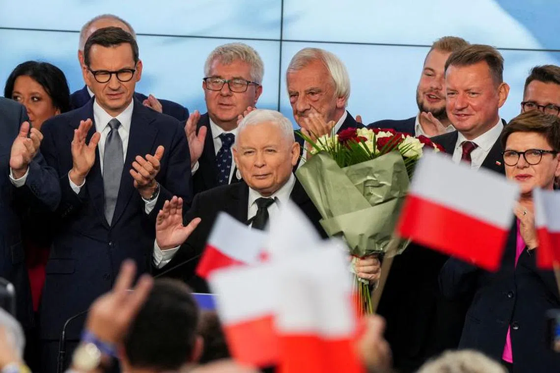 Leader of Poland's ruling conservative Law and Justice (PiS) party Jaroslaw Kaczynski, holds flowers during a speech after the exit poll results are announced in Warsaw, Poland, October 15, 2023. REUTERS/Aleksandra Szmigiel