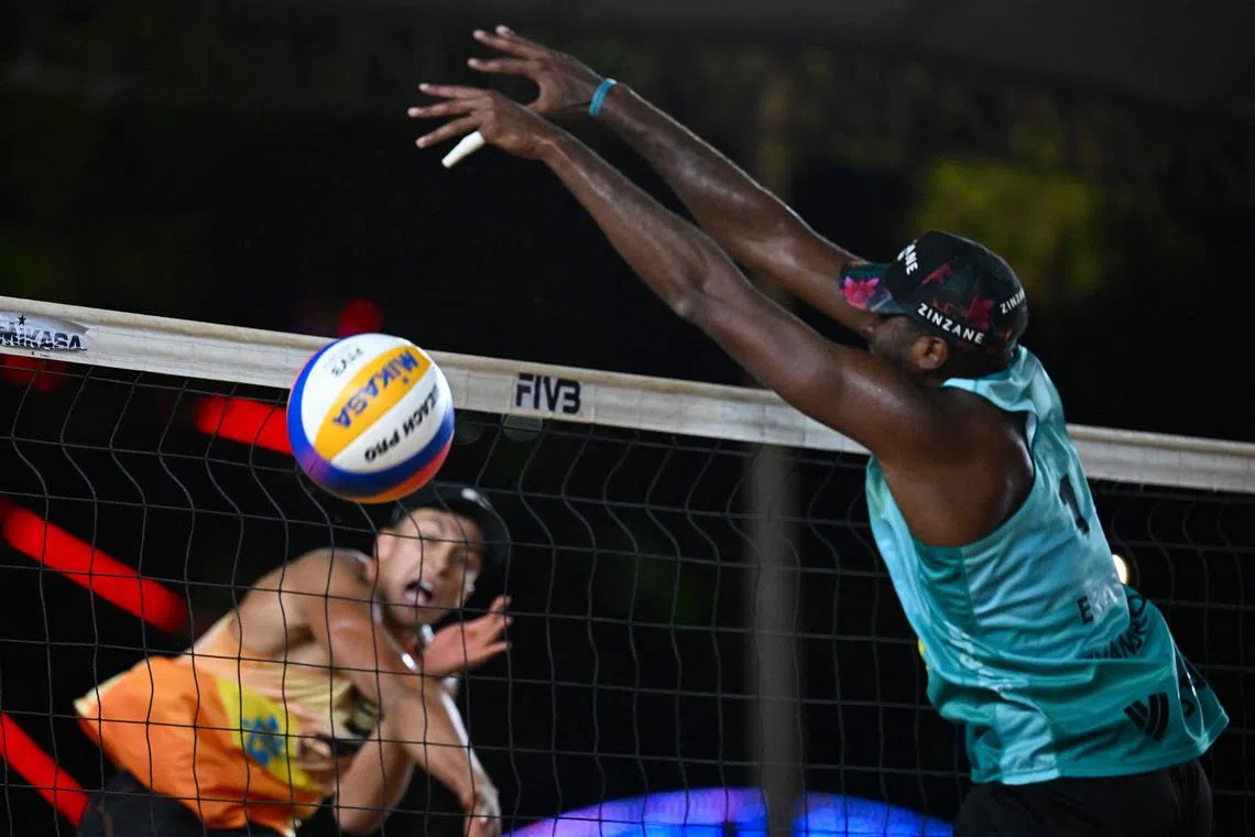 Netherlands' Steven Van de Velde spikes the ball against Brazil’s Evandro during the volleyball Beach Pro Tour Elite 16 final match in Brasilia, Brazil, on May 5, 2024.