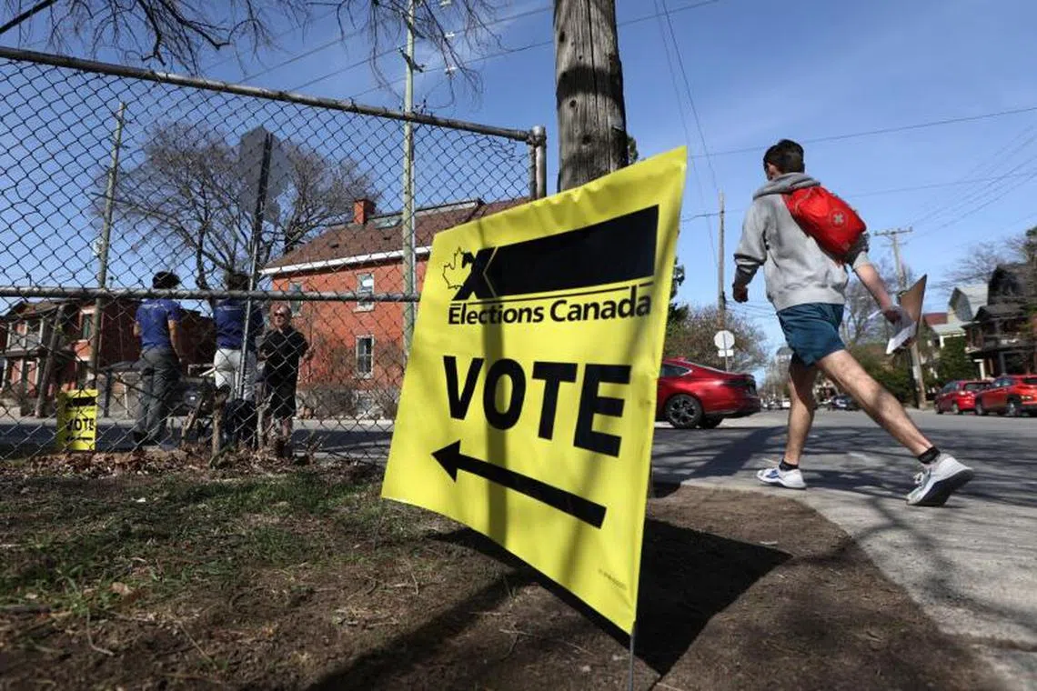 Vote signs outside a polling station during a federal election in Ottawa, Ontario, Canada, on Monday, April 28, 2025. The leaders of the two major parties criss-crossed the world's second-largest country multiple times since the election was called in late March, holding rallies, press conferences and shaking thousands of hands in battleground districts from the Ontario suburbs to the Vancouver region. Photographer: David Kawai/Bloomberg