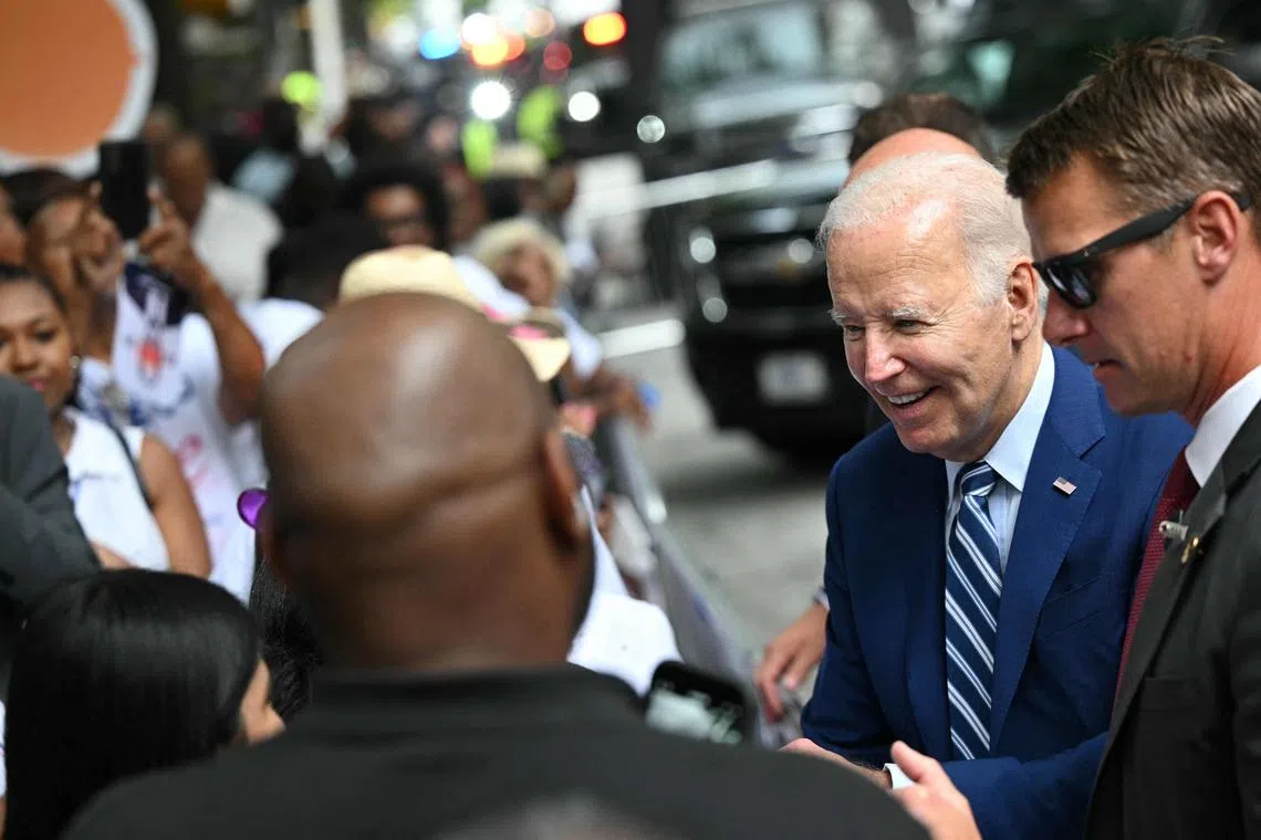US President Joe Biden greets supporters outside his hotel, ahead of the first presidential debate of the 2024 election, in Atlanta, Georgia.
