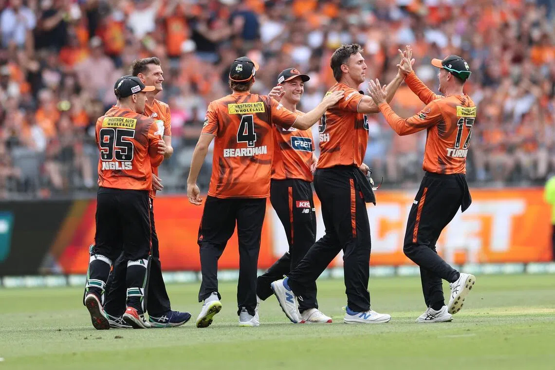 Perth Scorchers' Mitchell Marsh celebrates with teammates after catching Sydney Sixers' Moises Henriques in the Big Bash League T20 final at the Optus Stadium in Perth on Jan 25, 2026.