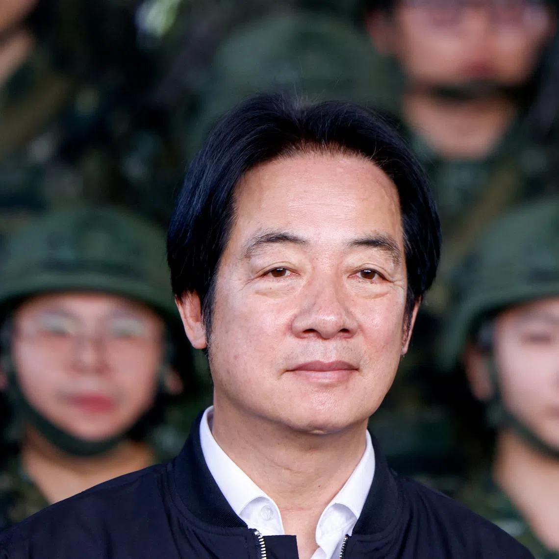 Taiwan President Lai Ching-te poses for photo after inspecting reservists operating a Taiwan made Hummer 2 Drone during a training session at Loung Te Industrial Parks Service Center in Yilan, Taiwan December 2, 2025. REUTERS/Ann Wang