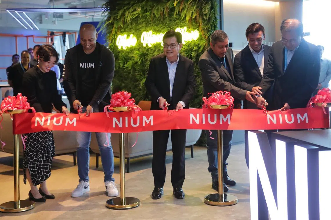 ST20230703_202380929062: Gin Tay/ tgnium03/ Timothy Goh SM/

(K-R): Ms. Jacqueline Poh, Managing Director at Singapore Economic Development Board;
Mr. Prajit Nanu, Co-Founder and Chief Executive Officer at Nium ;
Mr. Heng Swee Keat, Deputy Prime Minister and Coordinating Minister for Economic Policies;
Mr. Pratik Gandhi, Co-Founder and Chief Operating Officer at Nium;
Mr. Jeffrey Siow, Managing Director & Chief Operating Officer at Enterprise Singapore; and 
Mr. Kee Lock Chua, Chief Executive Officer at Vertex Holdings; 

at the ribbon cutting ceremony on July 3, 2023.