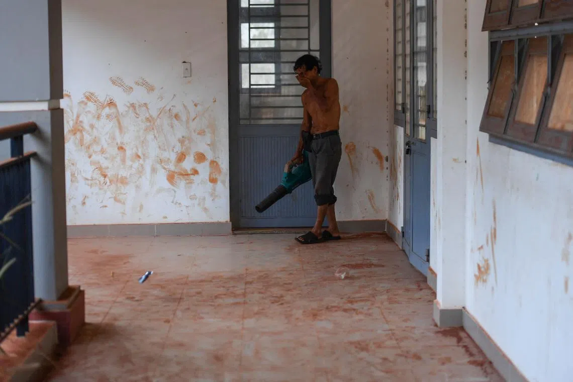 A man cleaning up dust at a primary school near the construction site of Long Thanh airport in Dong Nai province. 