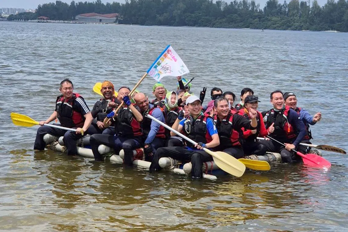 NHG Health group chief executive officer Joe Sim (left) at a bonding camp. Professor Sim actively participates in NHG Health’s leadership training sessions.