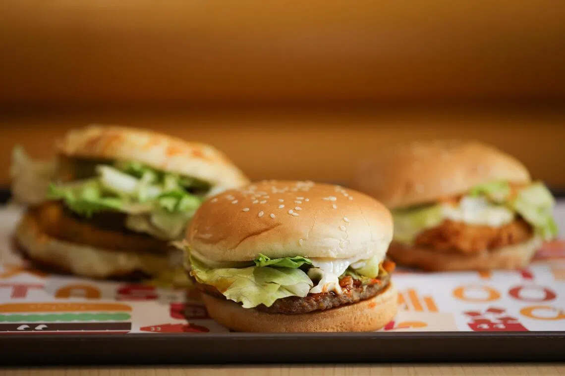 Lotteria’s Mozarella Burger (left), Kimchi Bulgogi Burger (centre) and Ria’s Shrimp Burger (right).