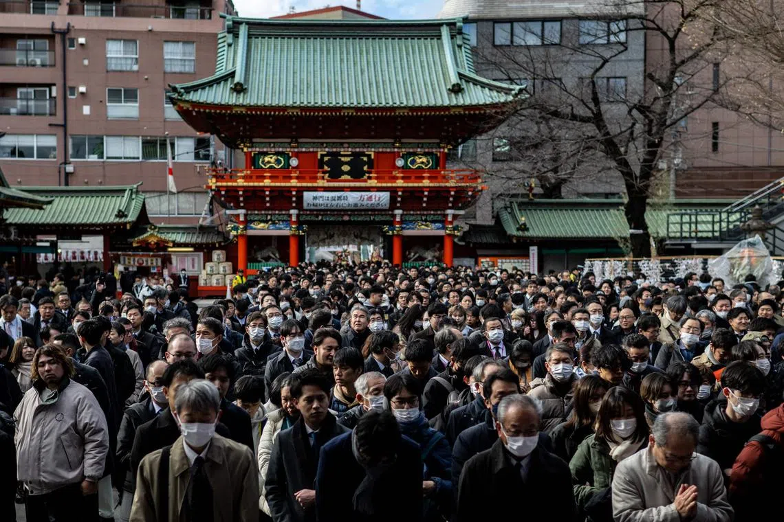 New Year prayers in Tokyo on January 4, 2024, on the first business day of the year. (Photo by Philip FONG / AFP)