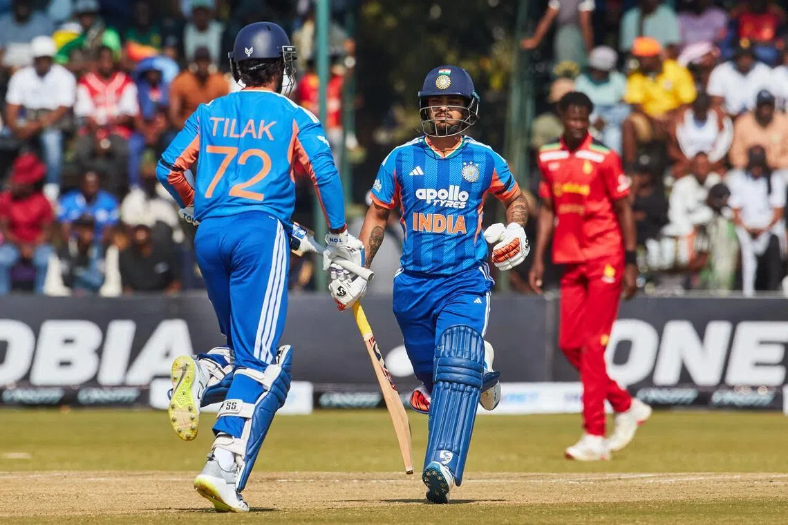 India's Ishan Kishan (C) runs between the wickets during the second Twenty20 international cricket match between Zimbabwe and India at Harare Sports Club in Harare, on July 25, 2026. (Photo by Jekesai NJIKIZANA / AFP)