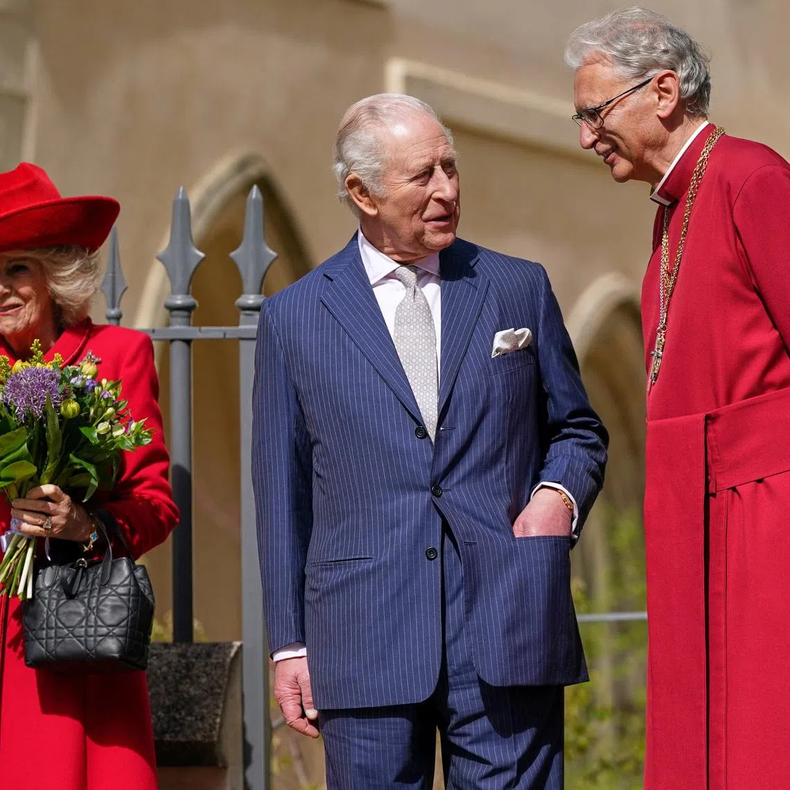 Britain's King Charles and Queen Camilla talk to Reverend Christopher Cocksworth as they leave after attending the Easter Matins Service at St. George's Chapel in Windsor, Britain, April 5, 2026. Alberto Pezzali/Pool via REUTERS