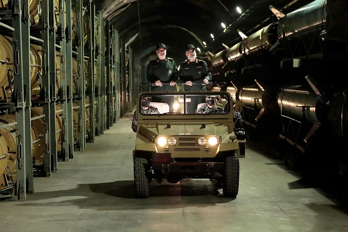 General Hossein Salami (left) touring an underground missile base at an undisclosed location in Iran.