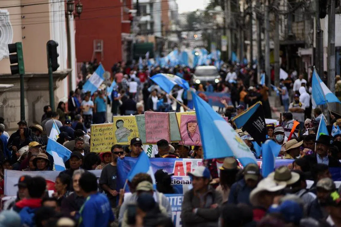 People march during a protest in support of democracy and to demand a peaceful democratic transition of power, in Guatemala City, Guatemala, December 7, 2023. REUTERS/Cristina Chiquin/File photo