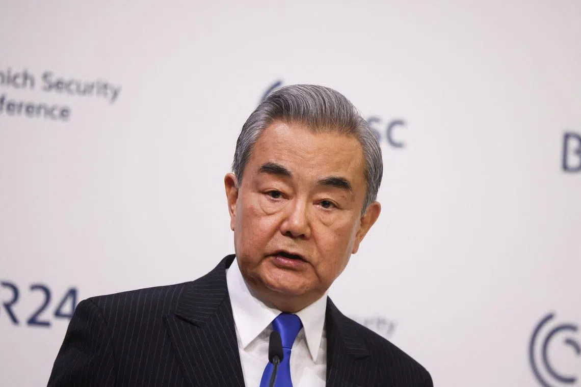 China's Foreign Minister Wang Yi speaks during the Munich Security Conference (MSC) in Munich, Germany, February 14, 2026. REUTERS/Liesa Johannssen