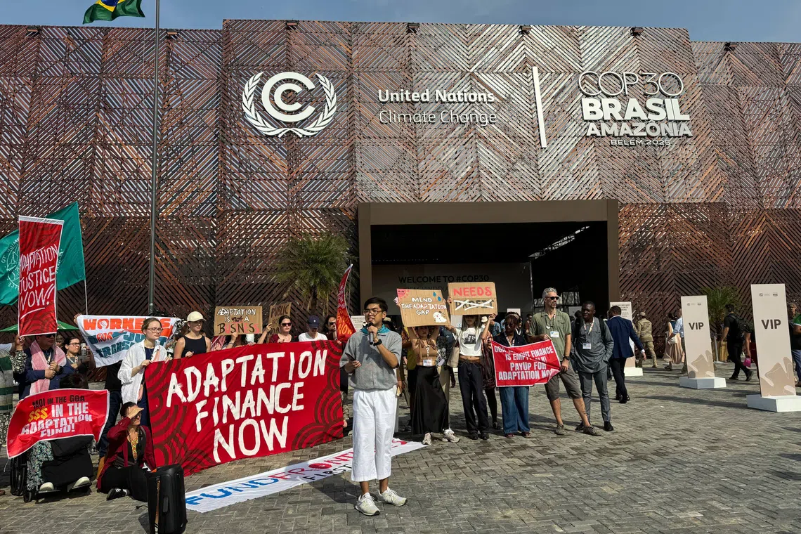 A protest calling for adaptation finance outside the COP30 Blue Zone on Nov 13.