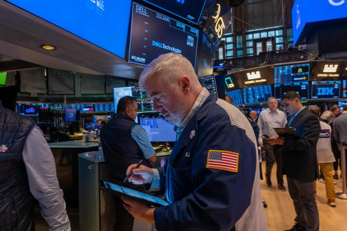 Traders work on the New York Stock Exchange floor, in New York City. 