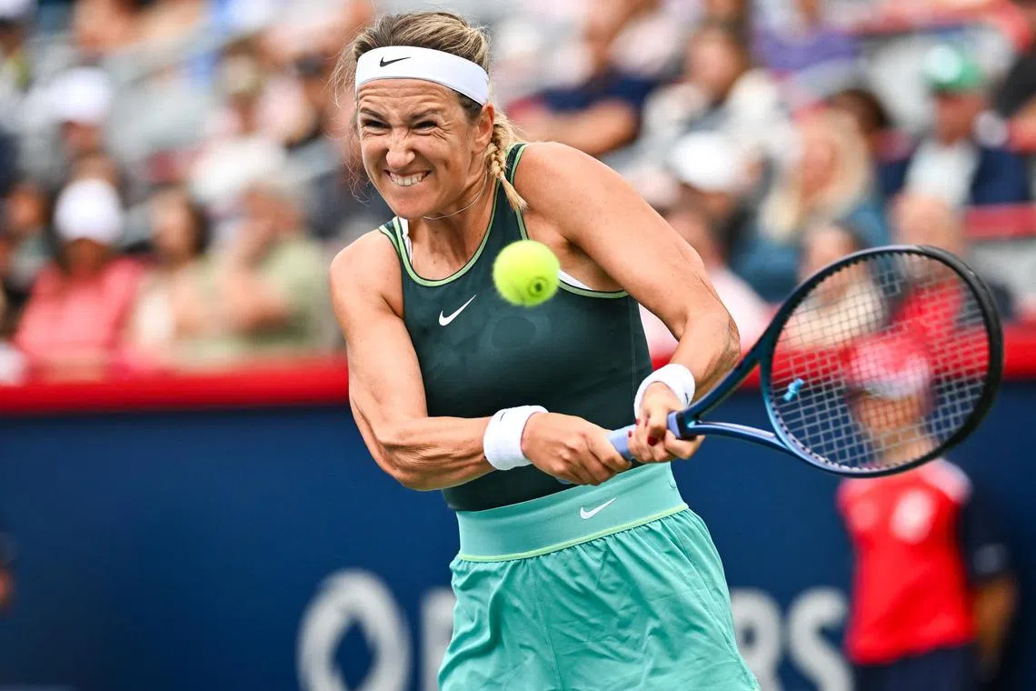 Victoria Azarenka of Belarus hitting a return in the first set against Magda Linette of Poland at the Canadian Open.