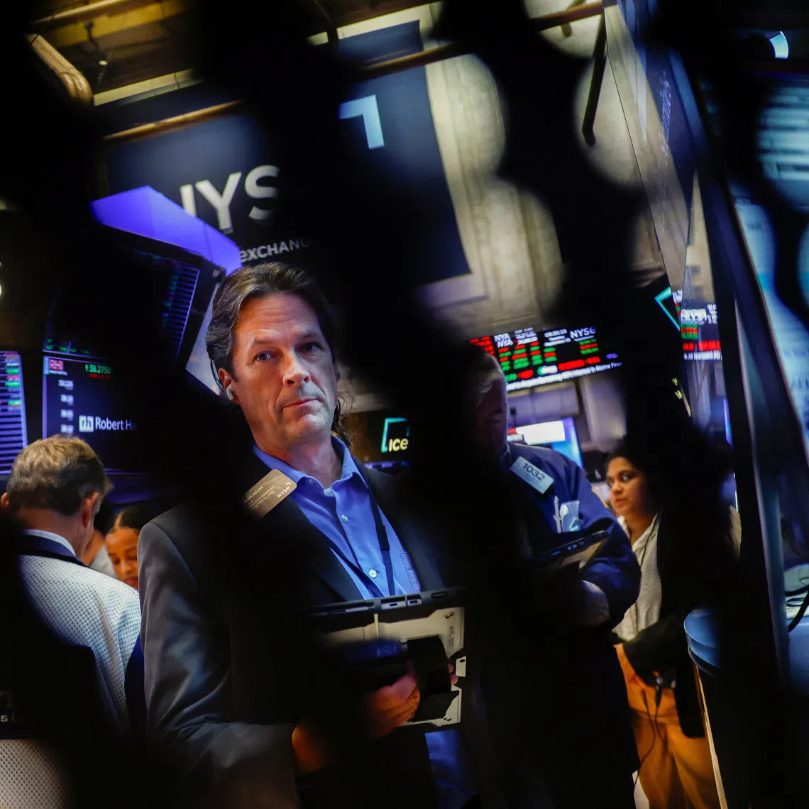 Traders work on the floor at the New York Stock Exchange on Sept 15 in New York City.
