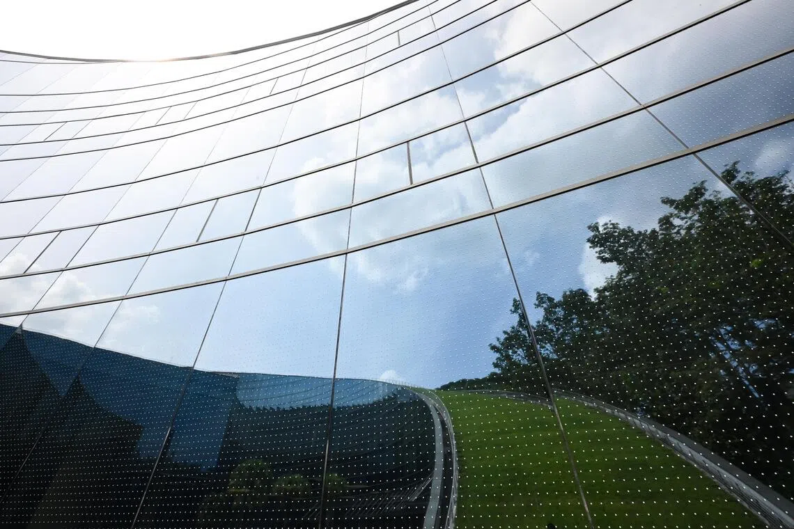 The patterns remain largely invisible from a distance, preserving the building’s aesthetic facade.