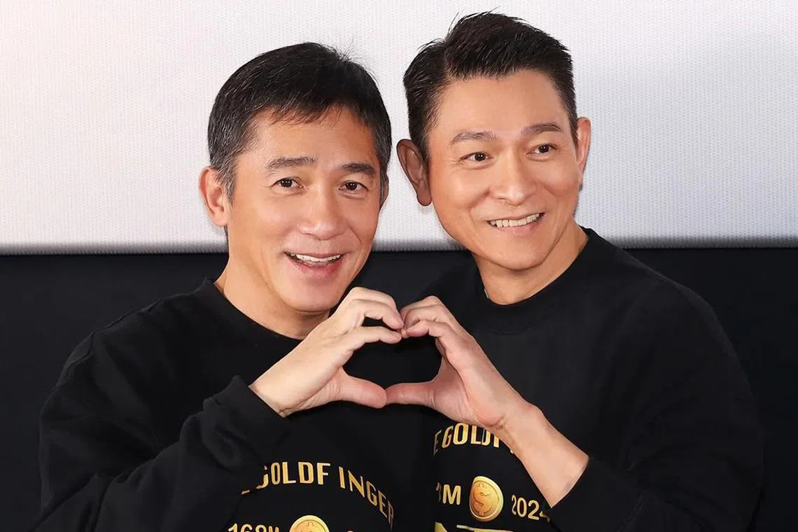 Hong Kong actors Tony Leung Chiu Wai (left) and Andy Lau promoting their film The Goldfinger in Beijing.