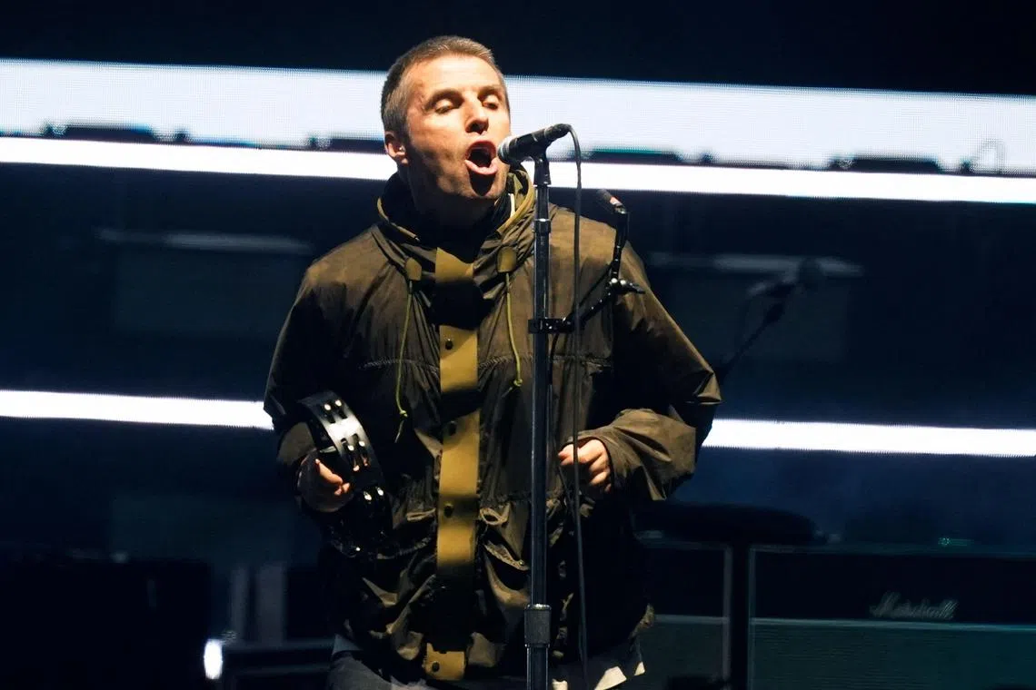 Liam Gallagher, lead singer of British rock band Oasis performs on stage at the Principality Stadium in Cardiff on July 4, 2025, during the opening concert of their highly anticipated reunion tour nearly 16 years after last performing together. Two consecutive nights of concerts at the Principality Stadium in the Welsh capital mark the start of a 41-date run of gigs spanning the world. (Photo by AFP stringer / AFP) / RESTRICTED TO EDITORIAL USE - NOT TO BE USED AFTER JULY 3, 2026
