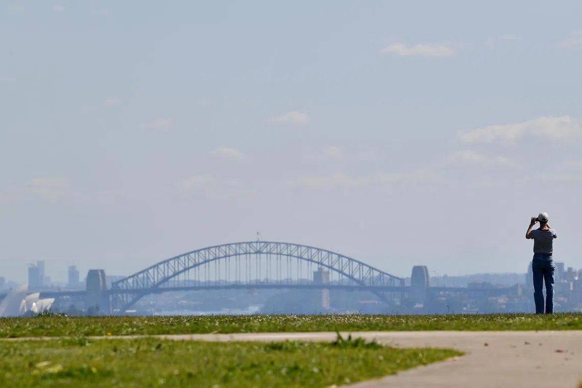 Wispy shrouds cloaked landmarks such as the Harbour Bridge and Sydney Opera House.