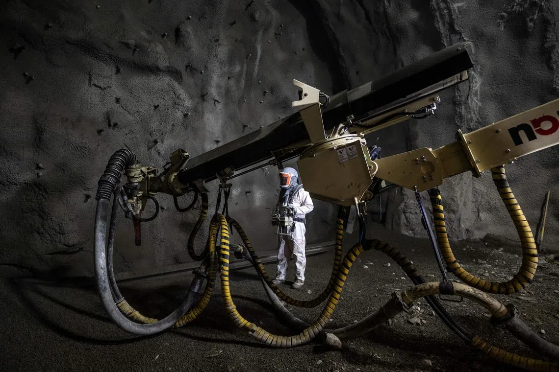 A man works at the construction site of a tunnel for the TAV high-speed train line (Treno Alta Velocita) between Lyon and Turin, in Saint-Julien-Montdenis, southeastern France, on Jan 18, 2023. 