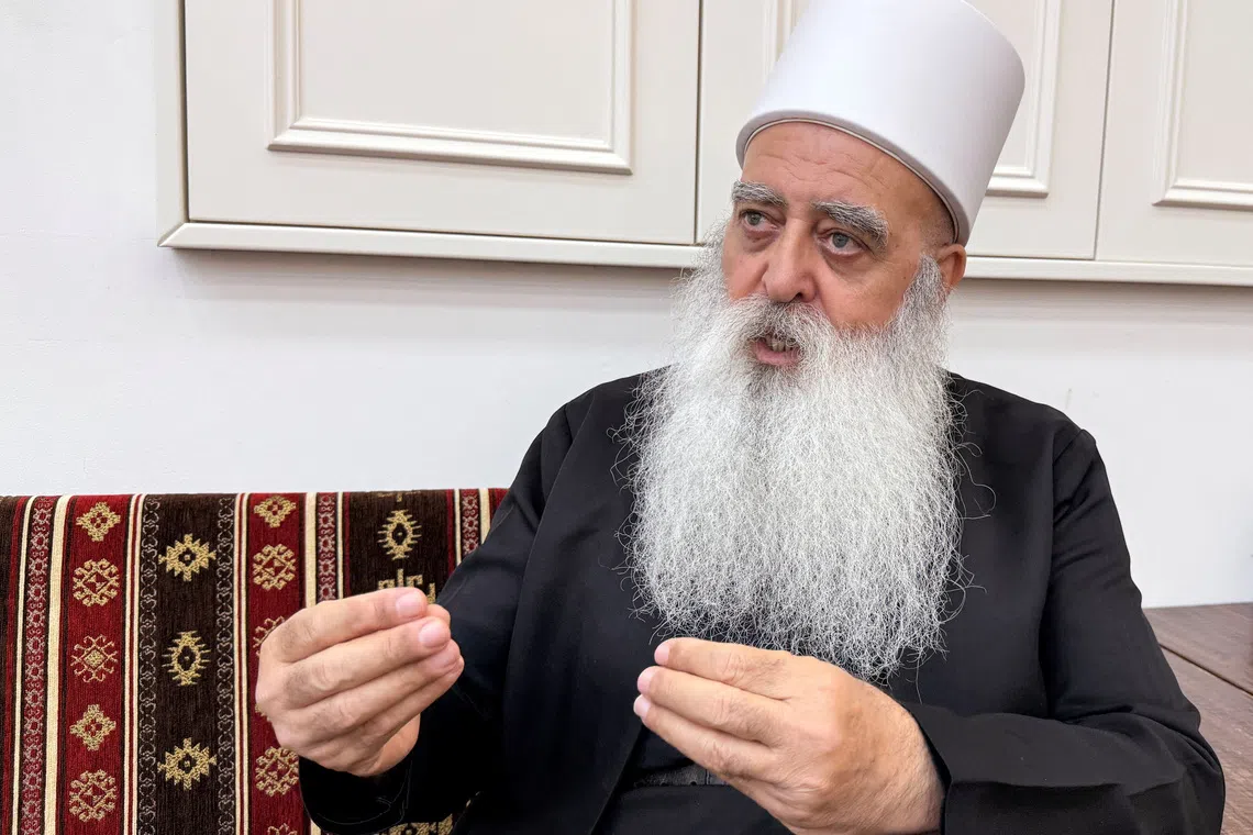 Leader of the Druze community in Israel, Sheikh Mowafaq Tarif, speaks with Reuters at his house in Julis, northern Israel July 28, 2025. REUTERS/Ali Sawafta