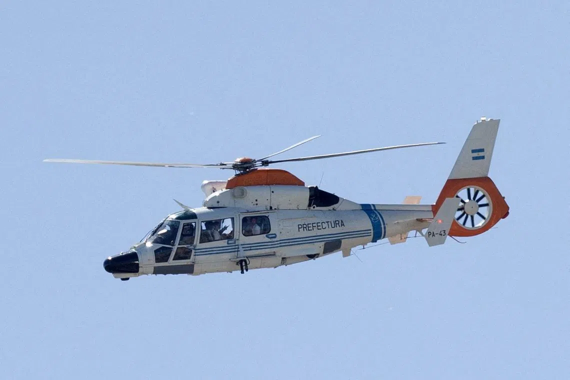 A police helicopter is seen carrying members of the Argentina team after the victory parade was cancelled because of the large crowd.