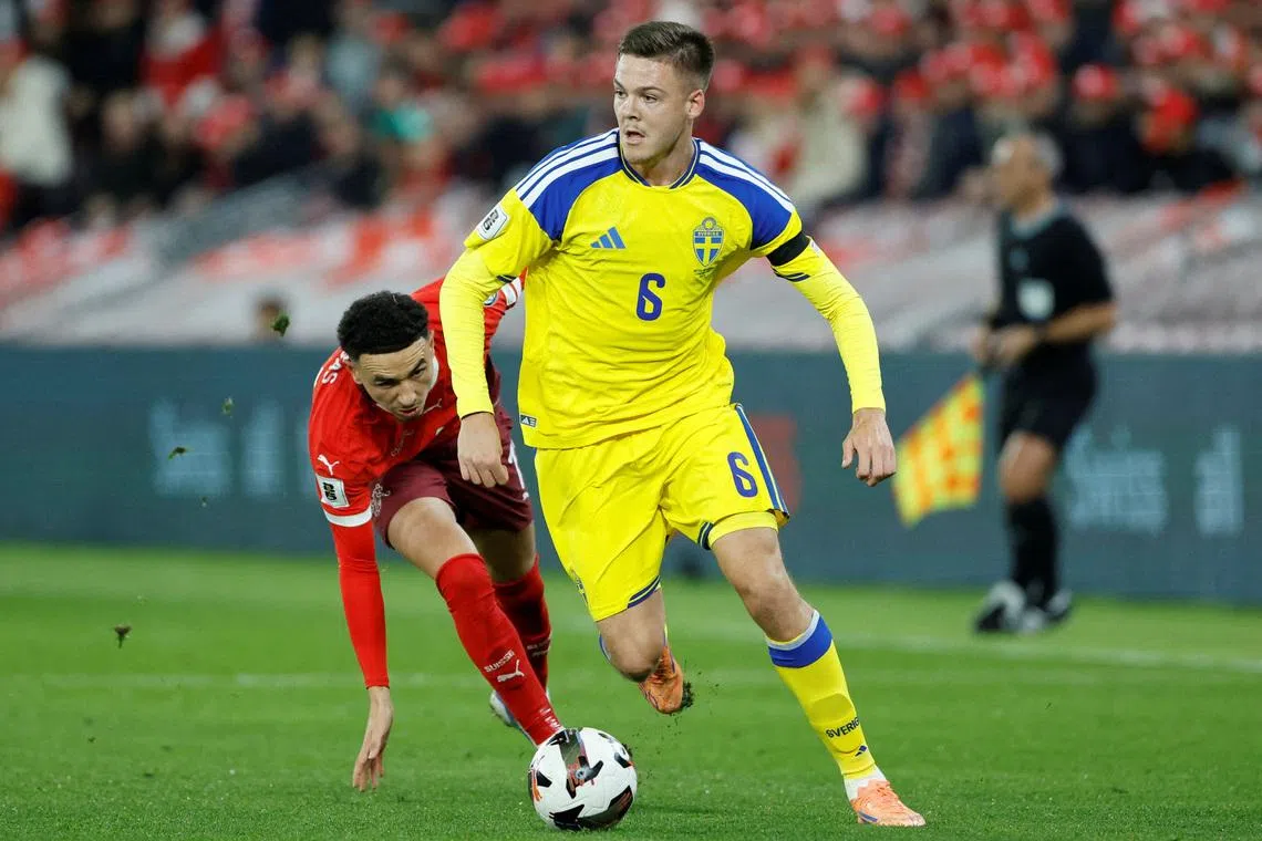 FILE PHOTO: Soccer Football - FIFA World Cup - UEFA Qualifiers - Group B - Switzerland v Sweden - Stade de Geneve, Geneva, Switzerland - November 15, 2025 Sweden's Emil Holm in action with Switzerland's Ruben Vargas REUTERS/Stefan Wermuth/File Photo
