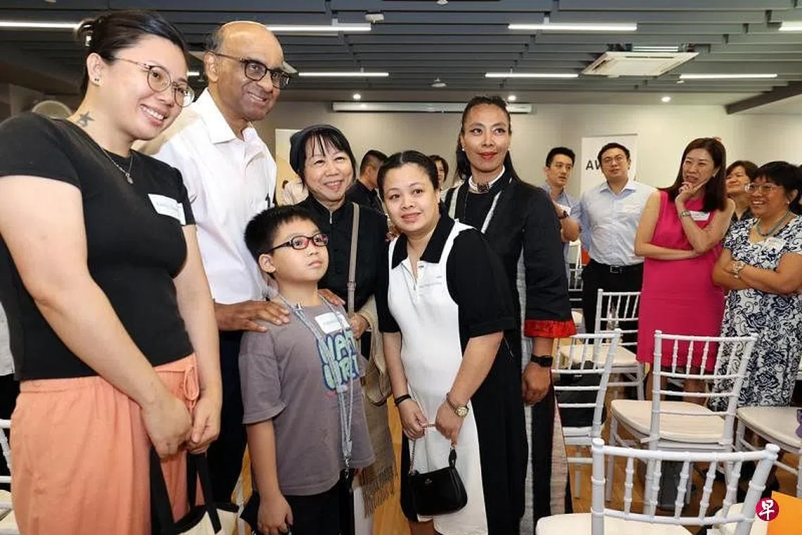 President Tharman Shanmugaratnam and his wife Jane Ittogi meeting guests and beneficiaries of AWWA's FEP on July 17.
