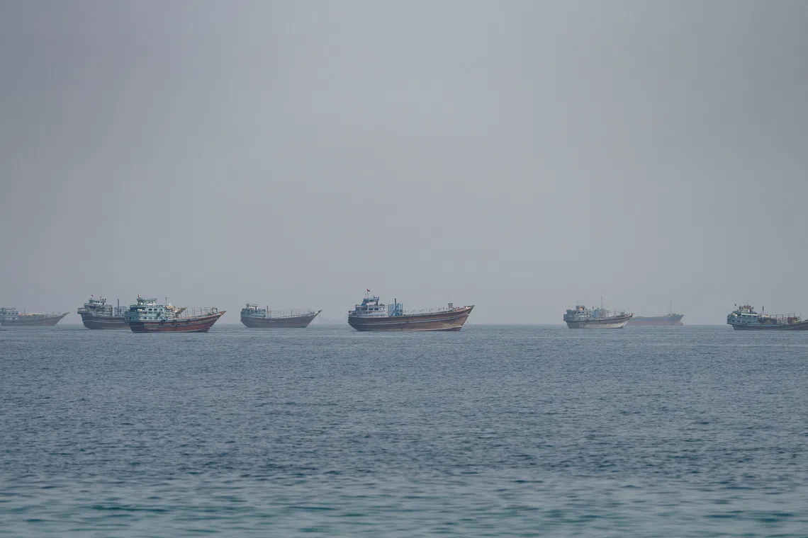 Vessels near the Strait of Hormuz, as seen from Musandam, Oman, August 24, 2026. REUTERS/Stringer