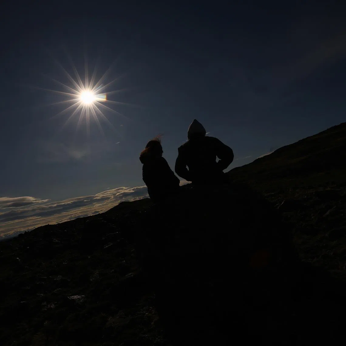 FILE PHOTO: People watch an annular solar eclipse in Las Horquetas, Santa Cruz, Argentina, October 2, 2024. REUTERS/Agustin Marcarian
