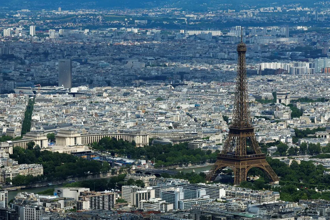 FILE PHOTO: An aerial view shows the Eiffel Tower, the Seine River, the Trocadero Champions Park, and the city rooftops of residential apartment buildings ahead of the Paris 2024 Olympics and Paralympics Games in Paris, France, July 10, 2024. REUTERS/Gonzalo Fuentes/File Photo