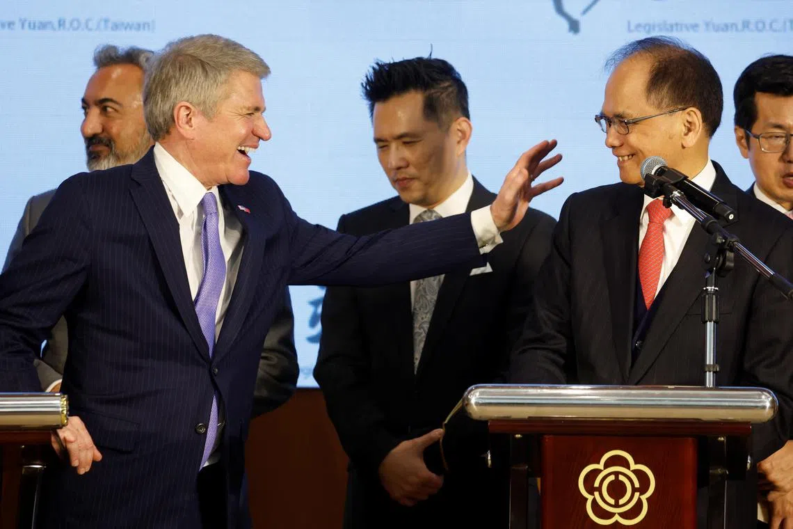 Michael McCaul, Chairman of the US House Foreign Affairs Committee, who is leading a delegation of US lawmakers visiting Taiwan, and Taiwan's Parliament Speaker You Si-kun, smile during a news conference.