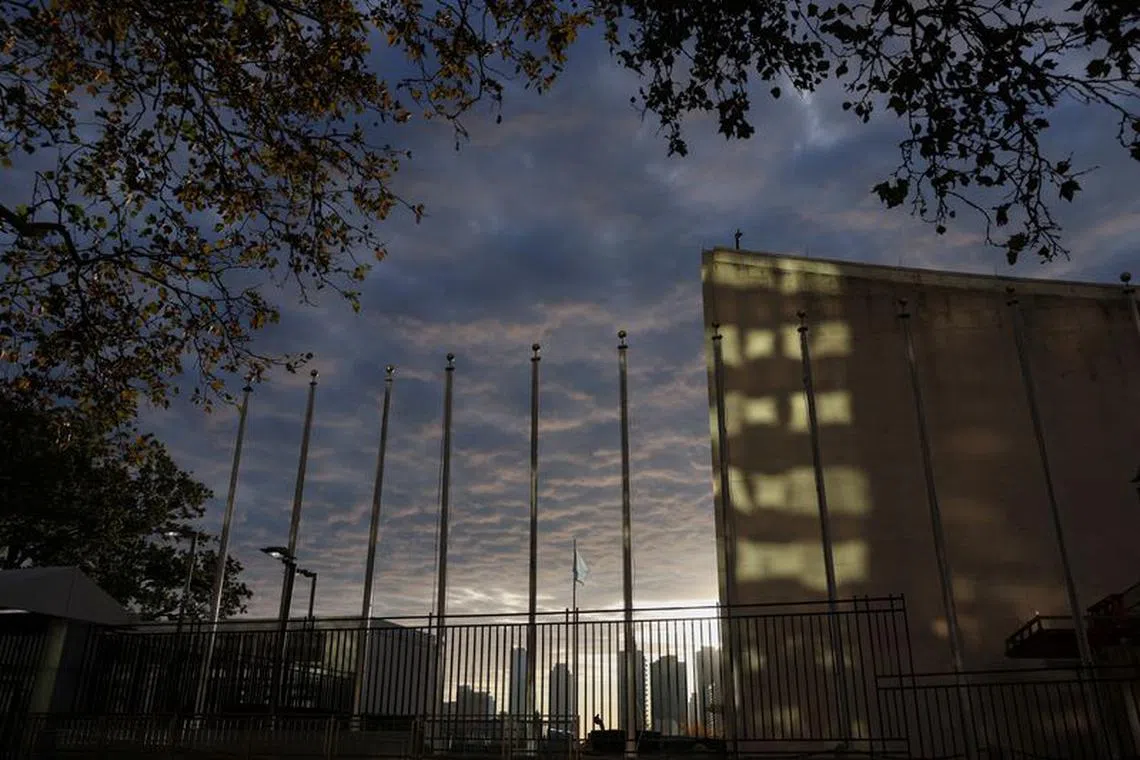 The flag representing the United Nations blows in the wind at UN headquarters during sunrise in New York City, U.S., October 24, 2023. REUTERS/Shannon Stapleton