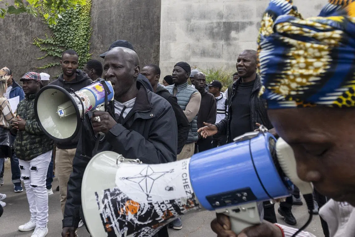Activists from the 'Sans Papier' movement, (French for Without Papers, undocumented people) during a weekly protest demanding that their status becomes legal, in Paris, France, on June 14.