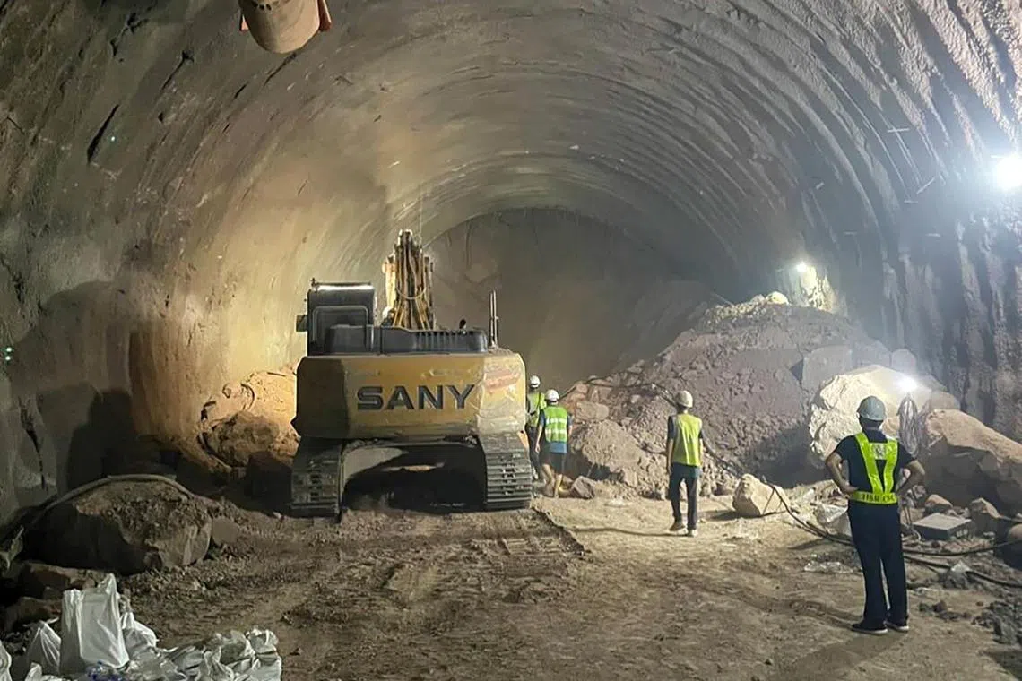 A handout photo made available by the State Railway of Thailand on Aug 26 shows rescuers working to remove collapsed soil and rocks during a rescue operation at an under-construction tunnel of a high-speed railway in Thailand's Nakhon Ratchasima province.