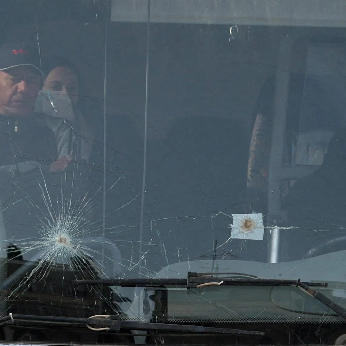 Palestinians sit in a bus as they get ready to leave Gaza through the Rafah border crossing between Gaza and Egypt after it was opened by Israel on Thursday for a limited number of people, in Khan Younis in the southern Gaza Strip, March 19, 2026. REUTERS/Ramadan Abed      TPX IMAGES OF THE DAY