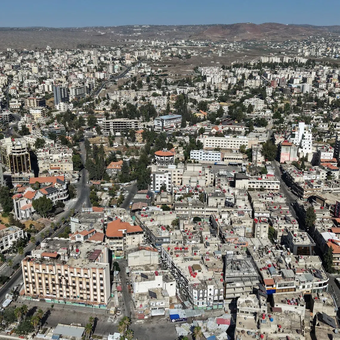 A drone view shows the predominantly Druze city of Sweida, following deadly clashes between Druze fighters, Sunni Bedouin tribes and government forces, in Syria July 25, 2025. REUTERS/Khalil Ashawi/File Photo